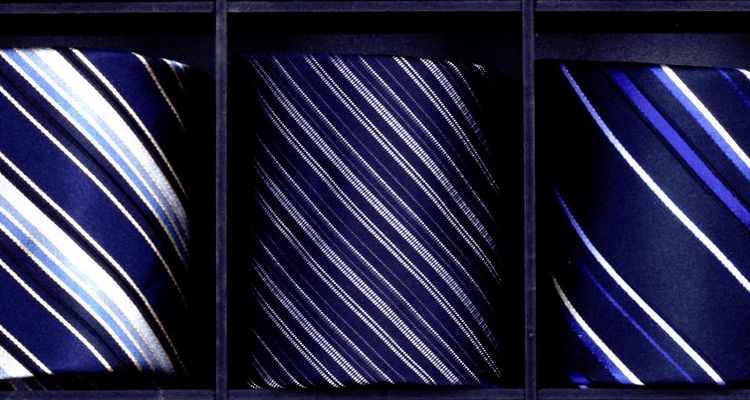 The lack of a tie becomes a symbol of organizational change